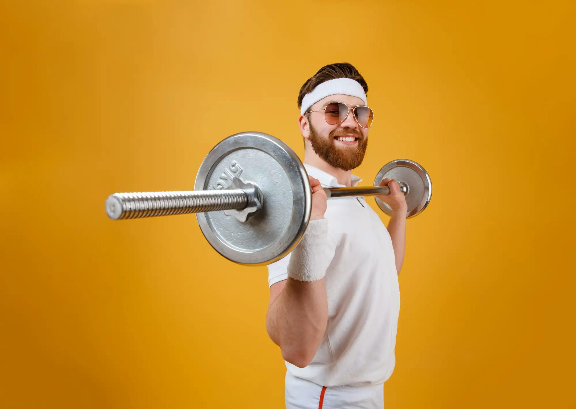 smiling sportsman with barbell